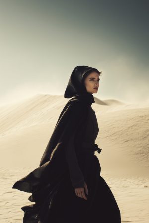 A woman is walking in the desert